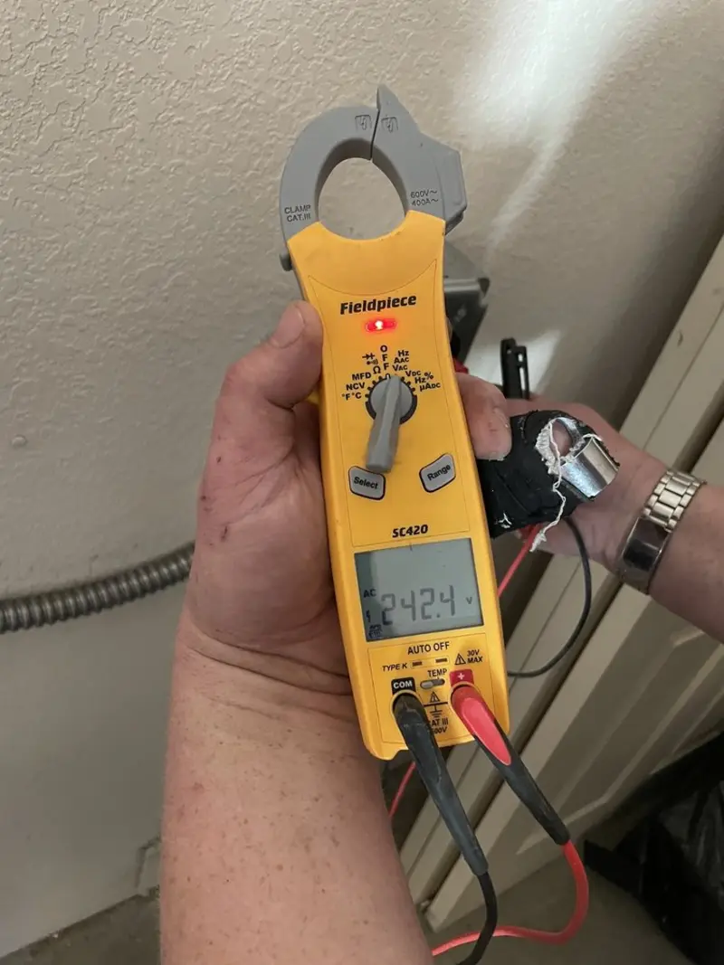 Voltage testing with clamp meter during Ceiling Fan Installation in Kingsbury